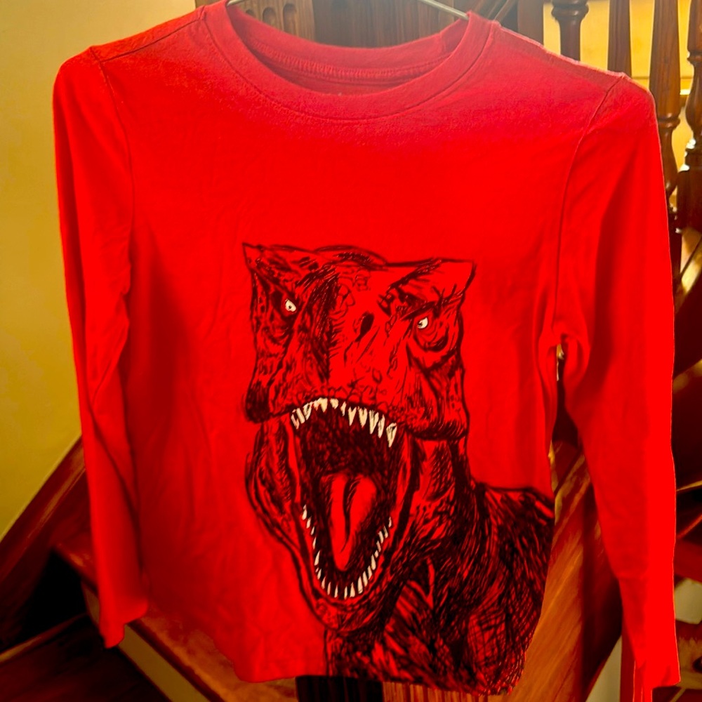 Kids long sleeve red dinosaur shirt. Size M 8/10